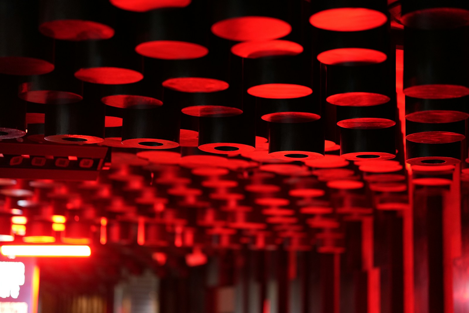 Rows of red lights in a dark setting