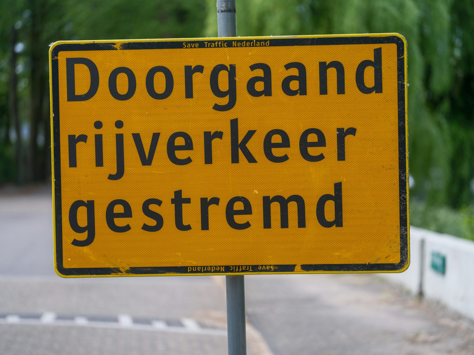 Traffic is impeded, according to the sign