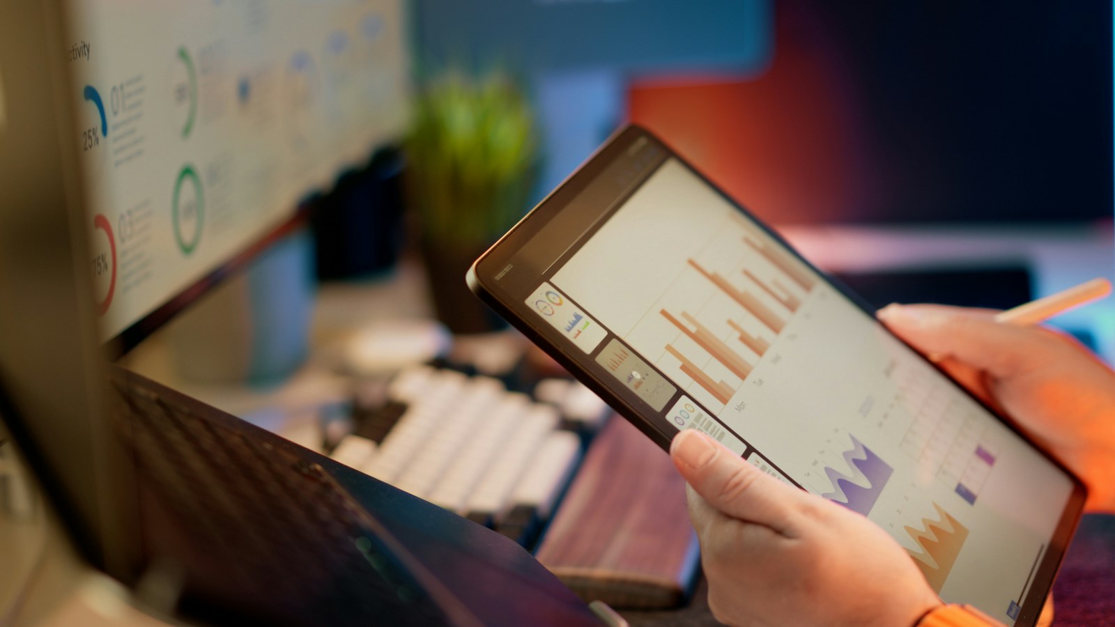 Someone analyzes financial data on a tablet