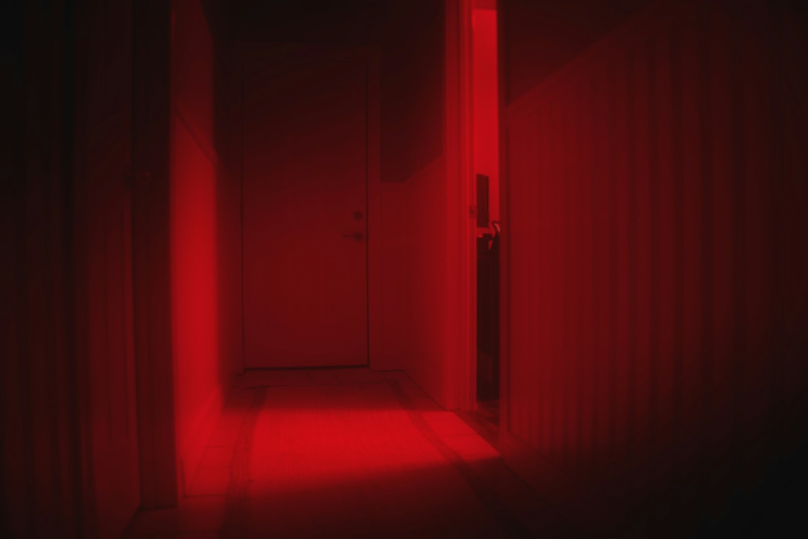 brown wooden door in dark room