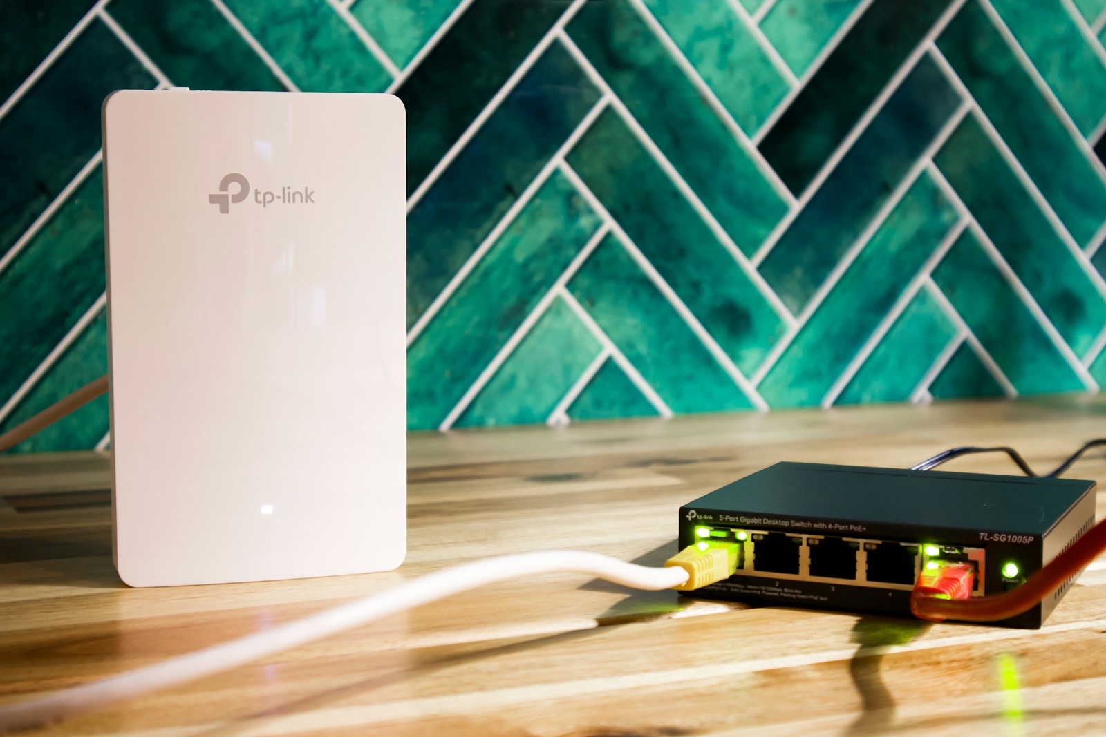 A wi-fi router and a network switch sit side-by-side