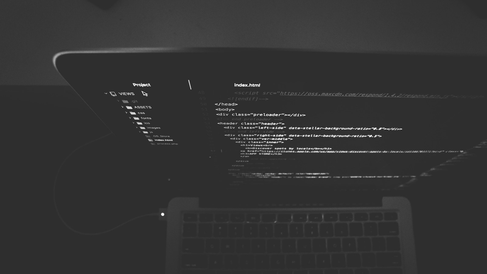 black and gray laptop displaying codes