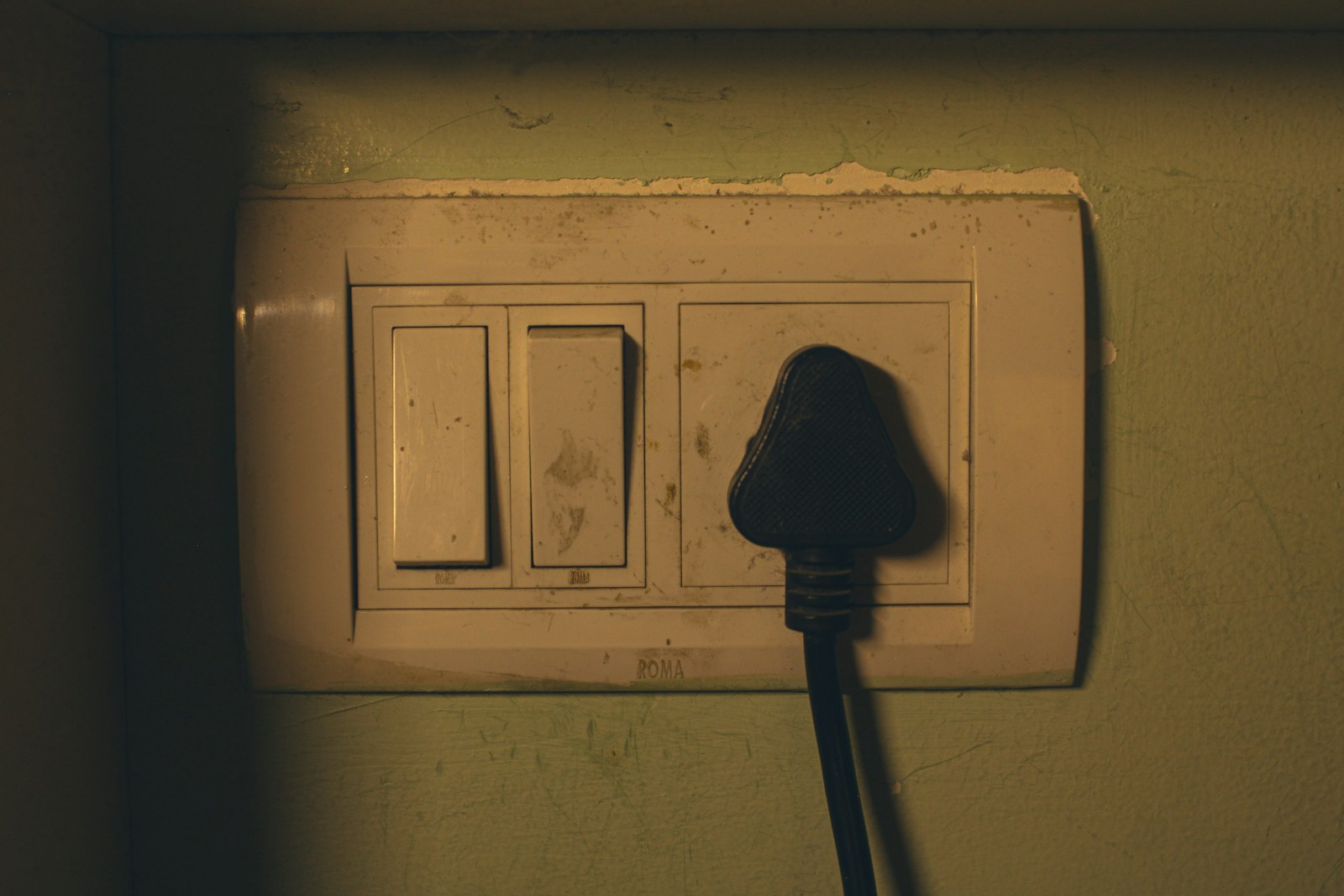 Electrical outlet with a black plug inserted