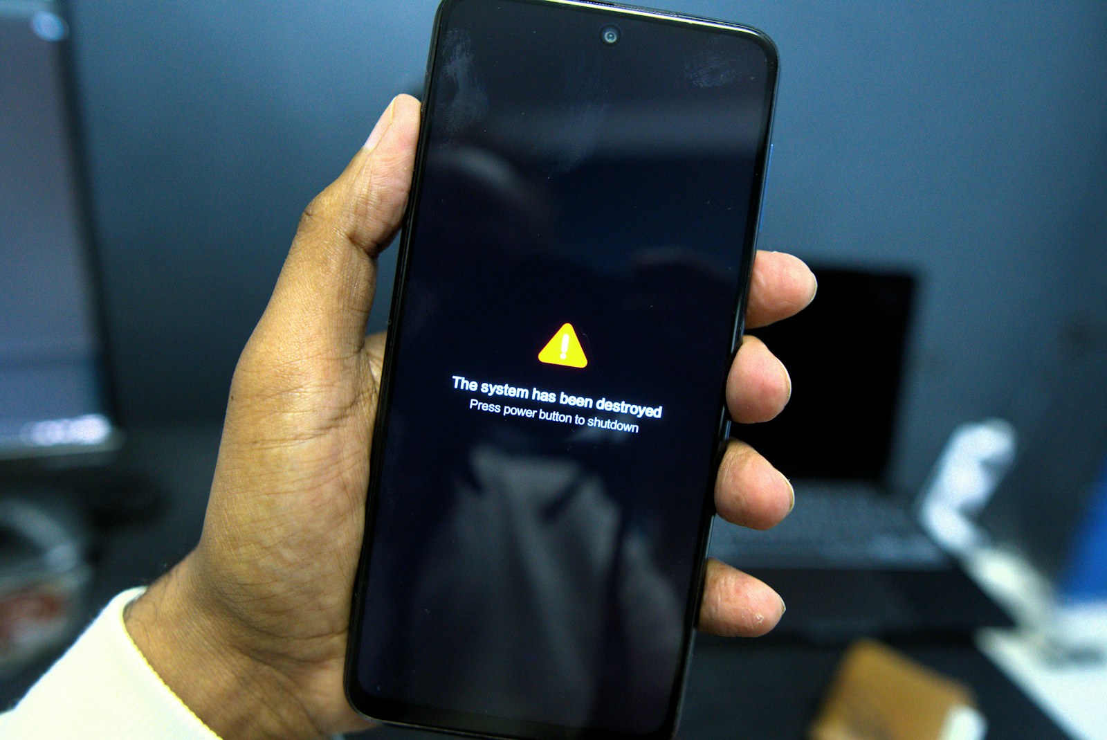 Phone shows a system failure warning message