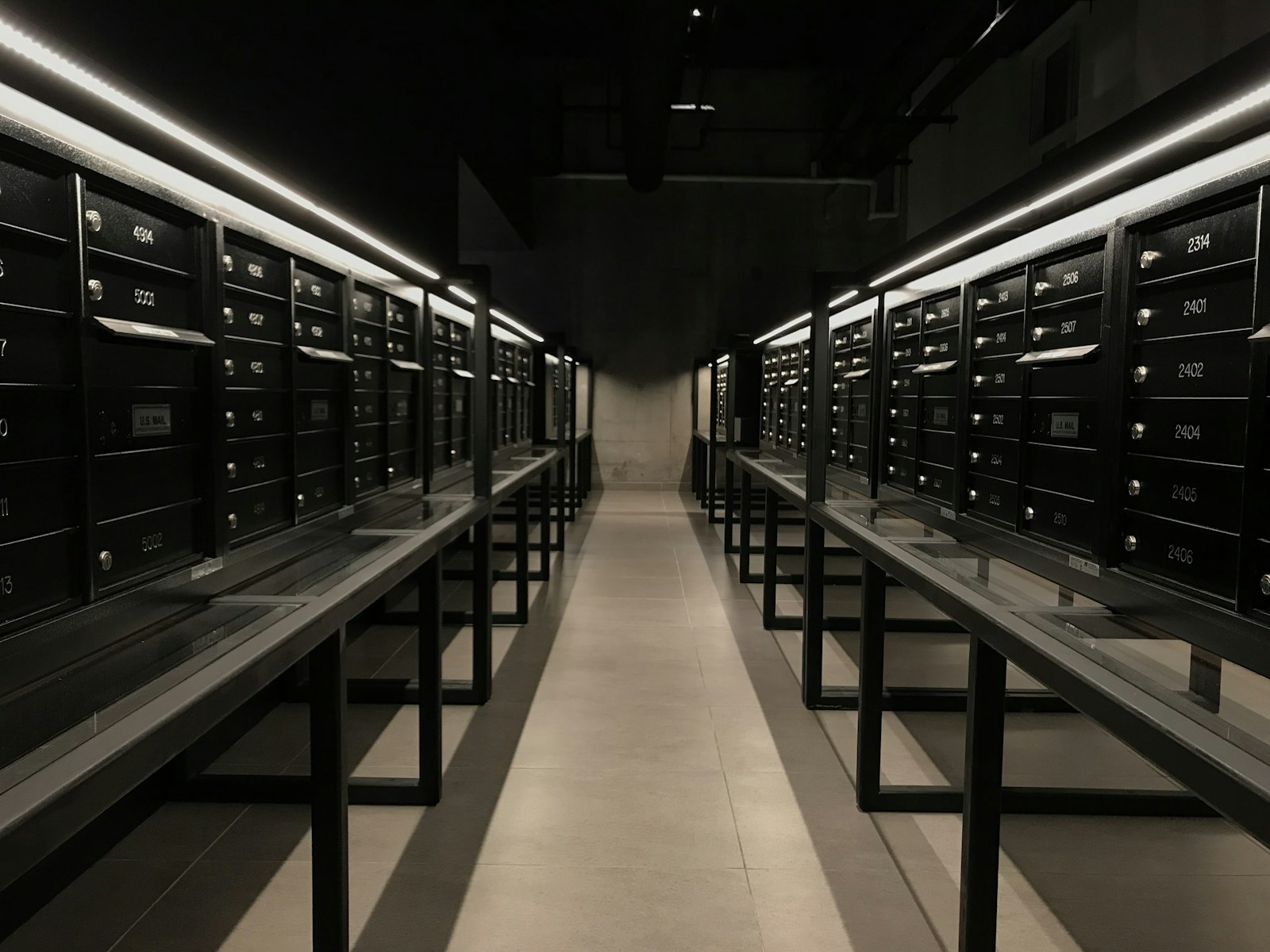 a long row of mail boxes sitting next to each other