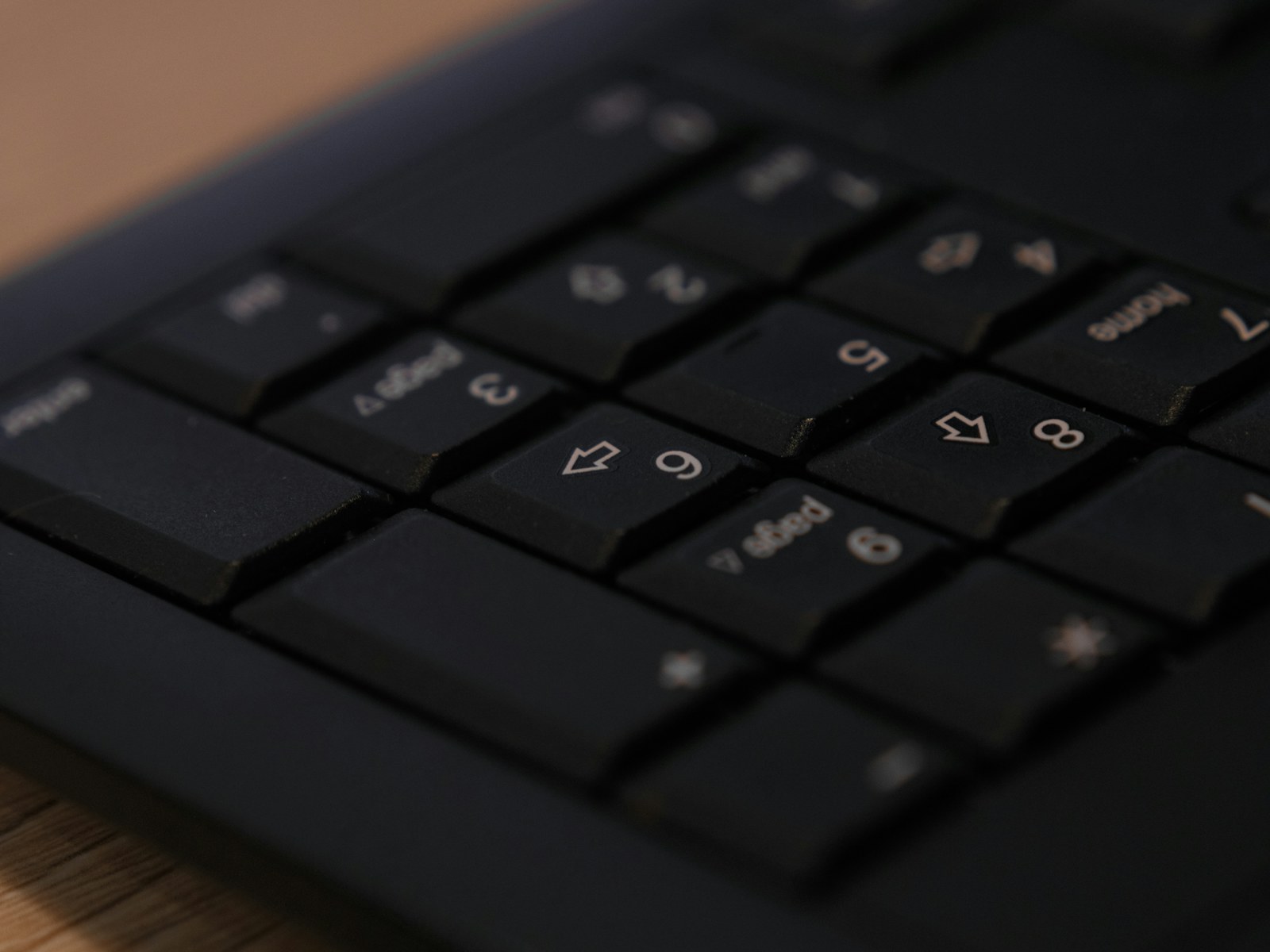 Black computer keyboard showing numeric keypad
