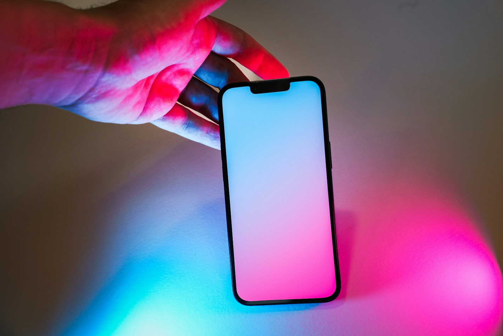 A person holding a cell phone in their hand
