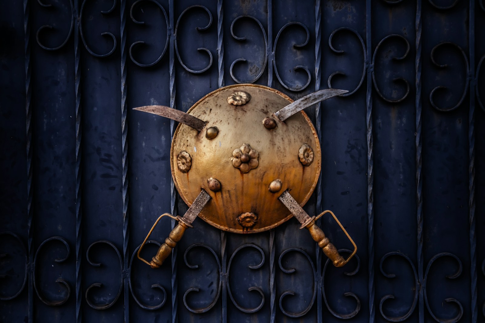 two silver swords on shield