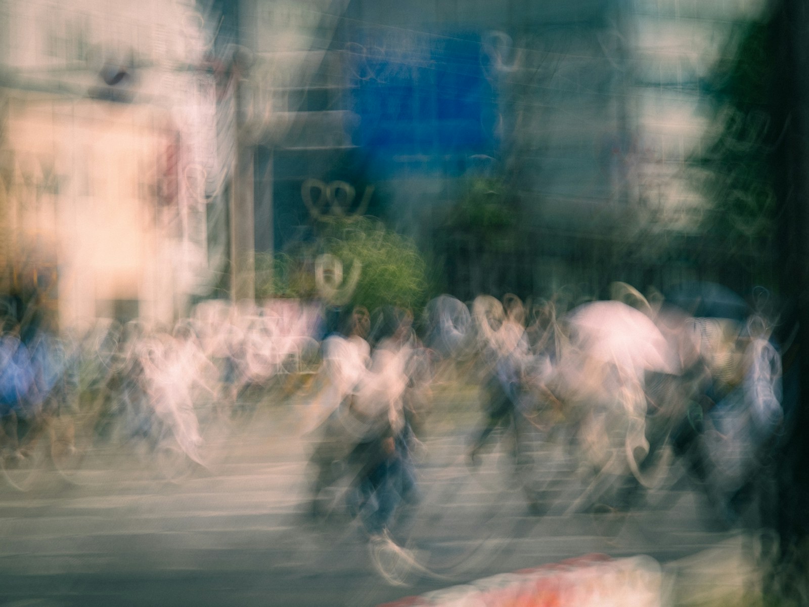 Blurred street scene with moving people and city lights