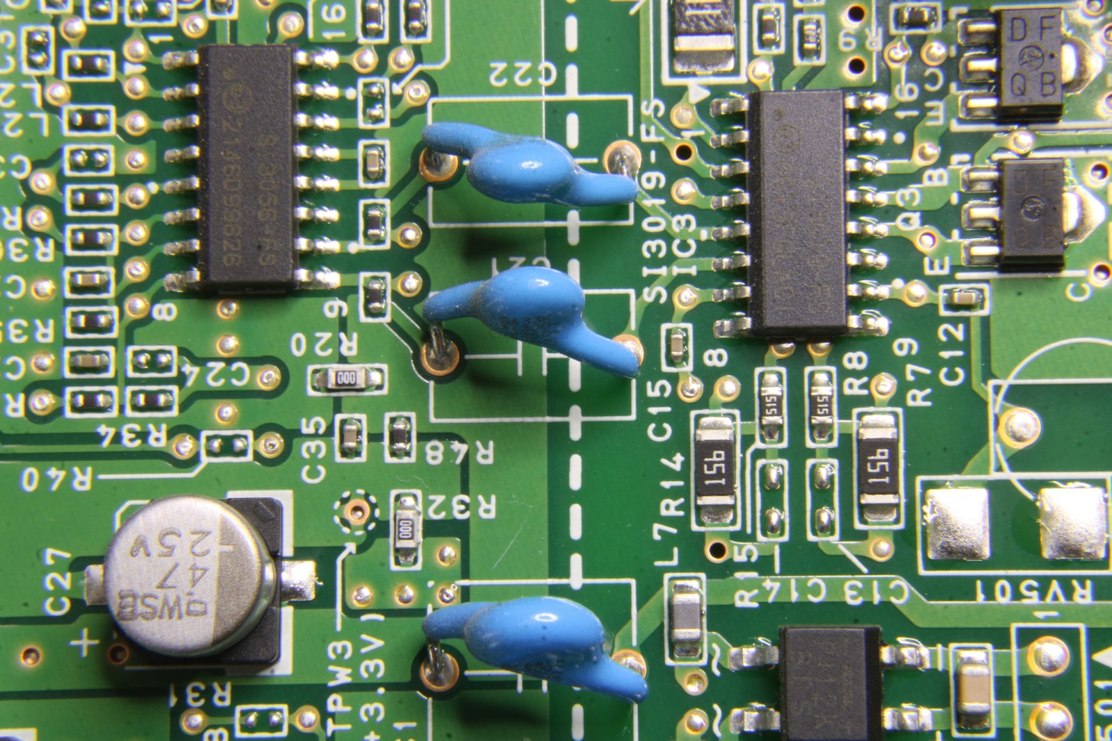 Detailed green circuit board showing various electronic components