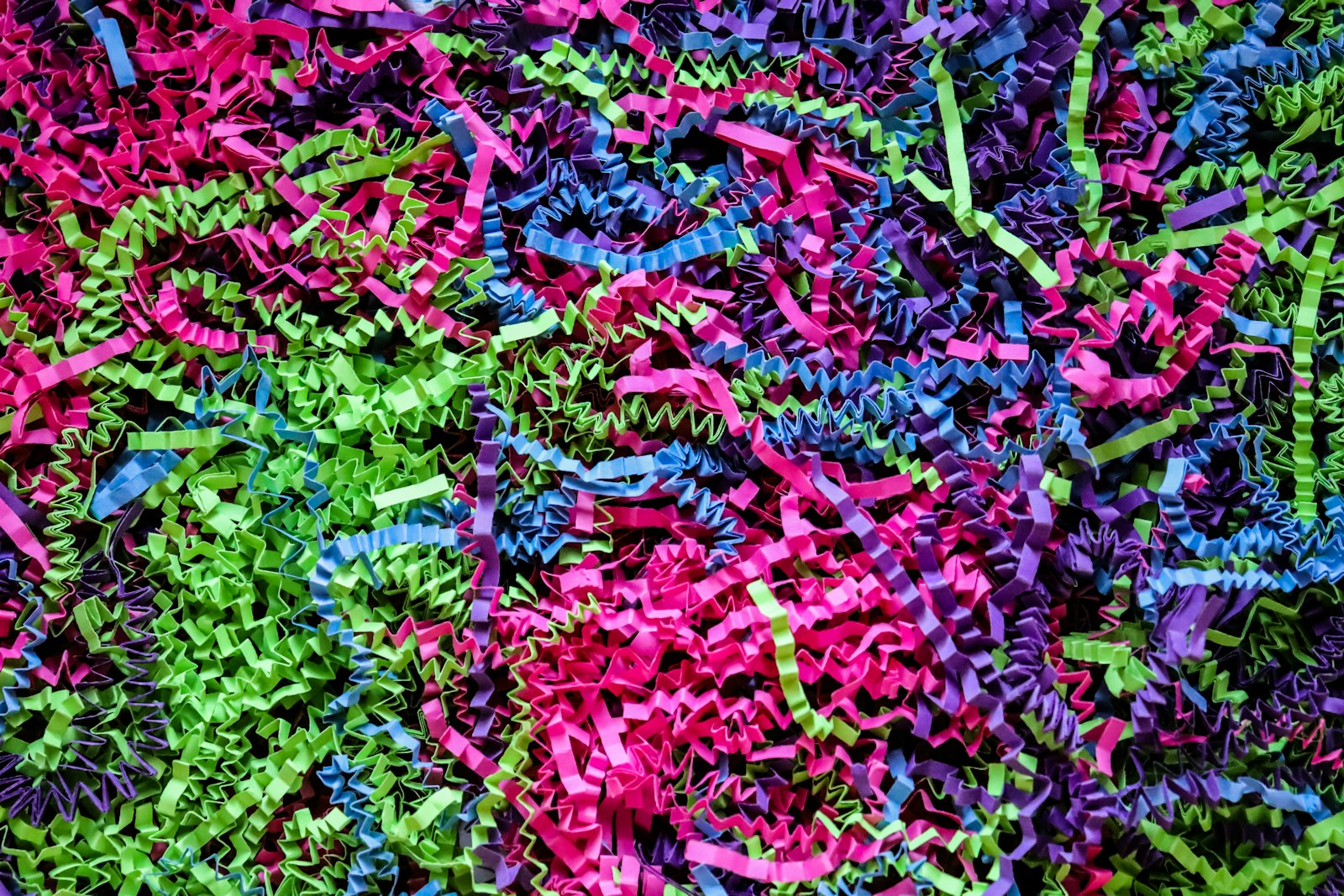 a large pile of colorful shredded paper