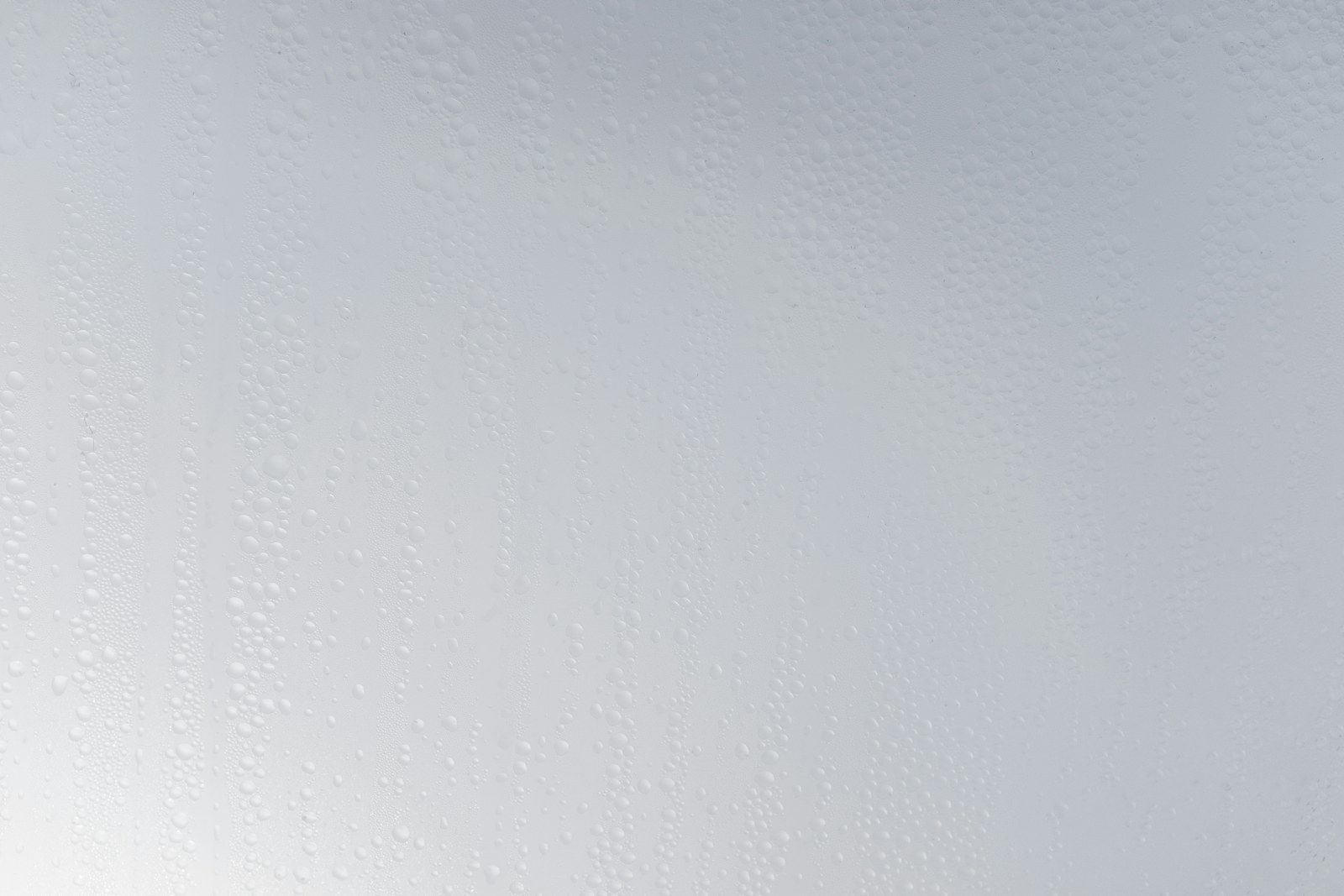 a white wall with water drops on it