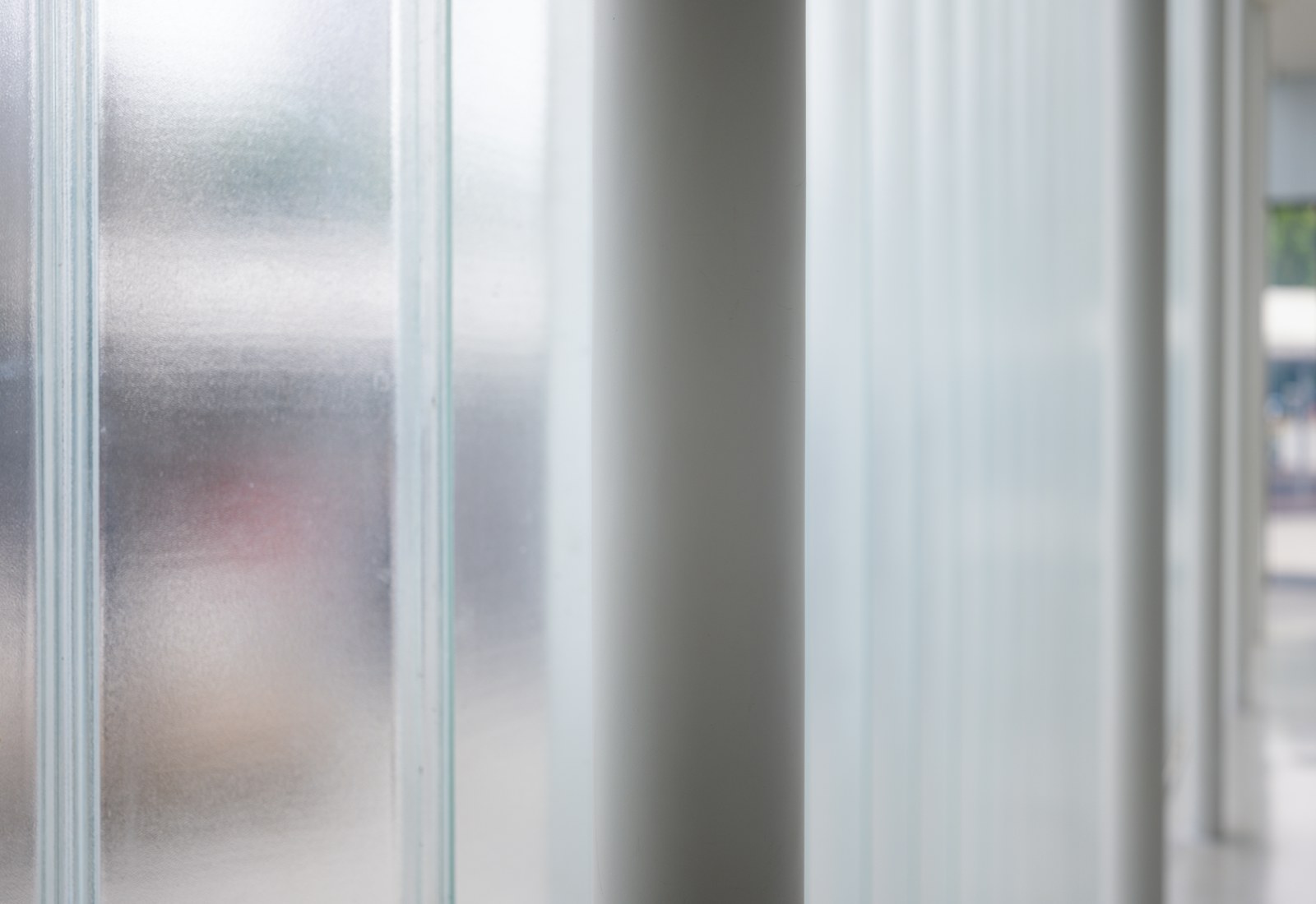 a close up of a glass door with a blurry background