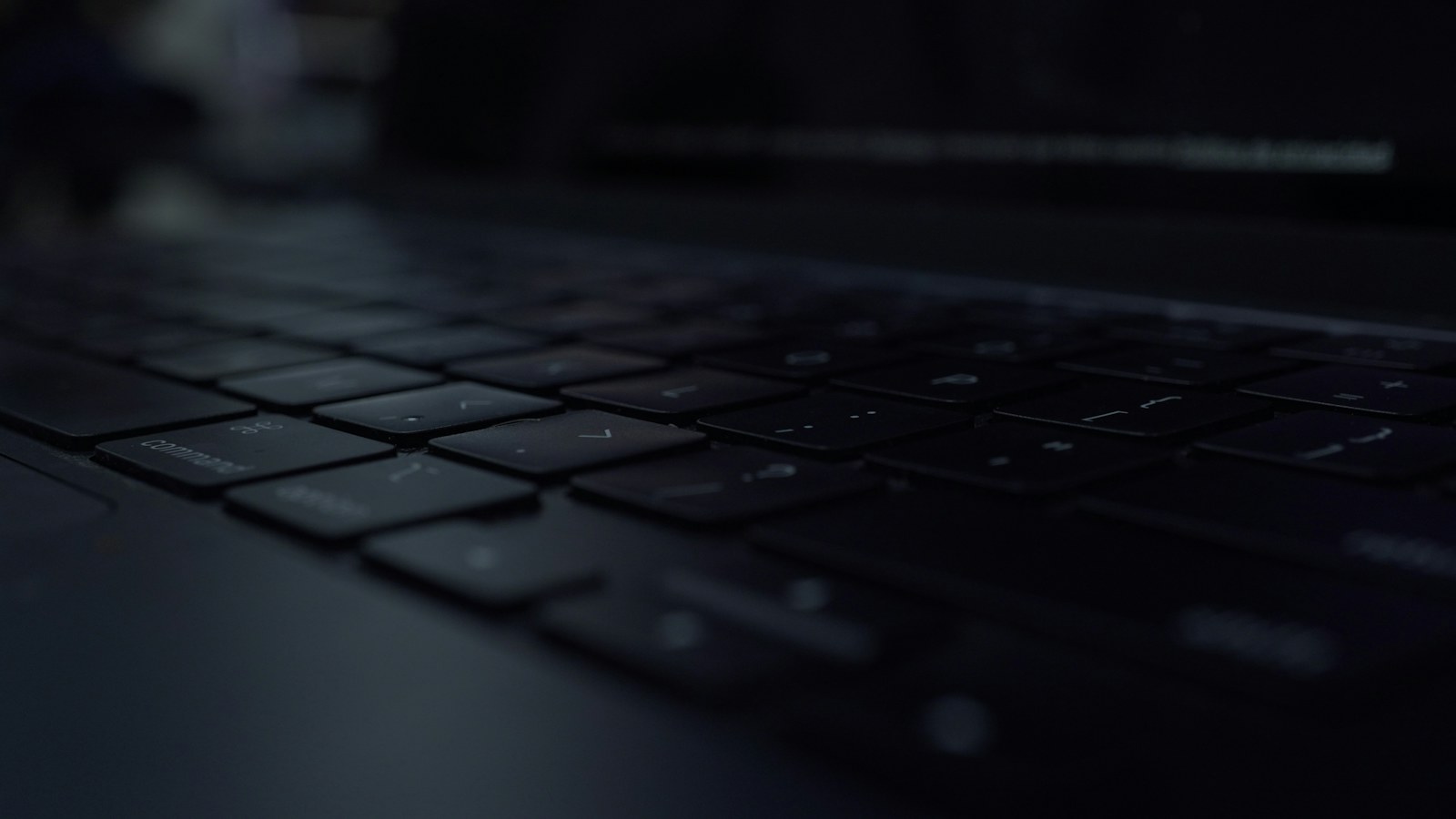 Close-up of a dark laptop keyboard