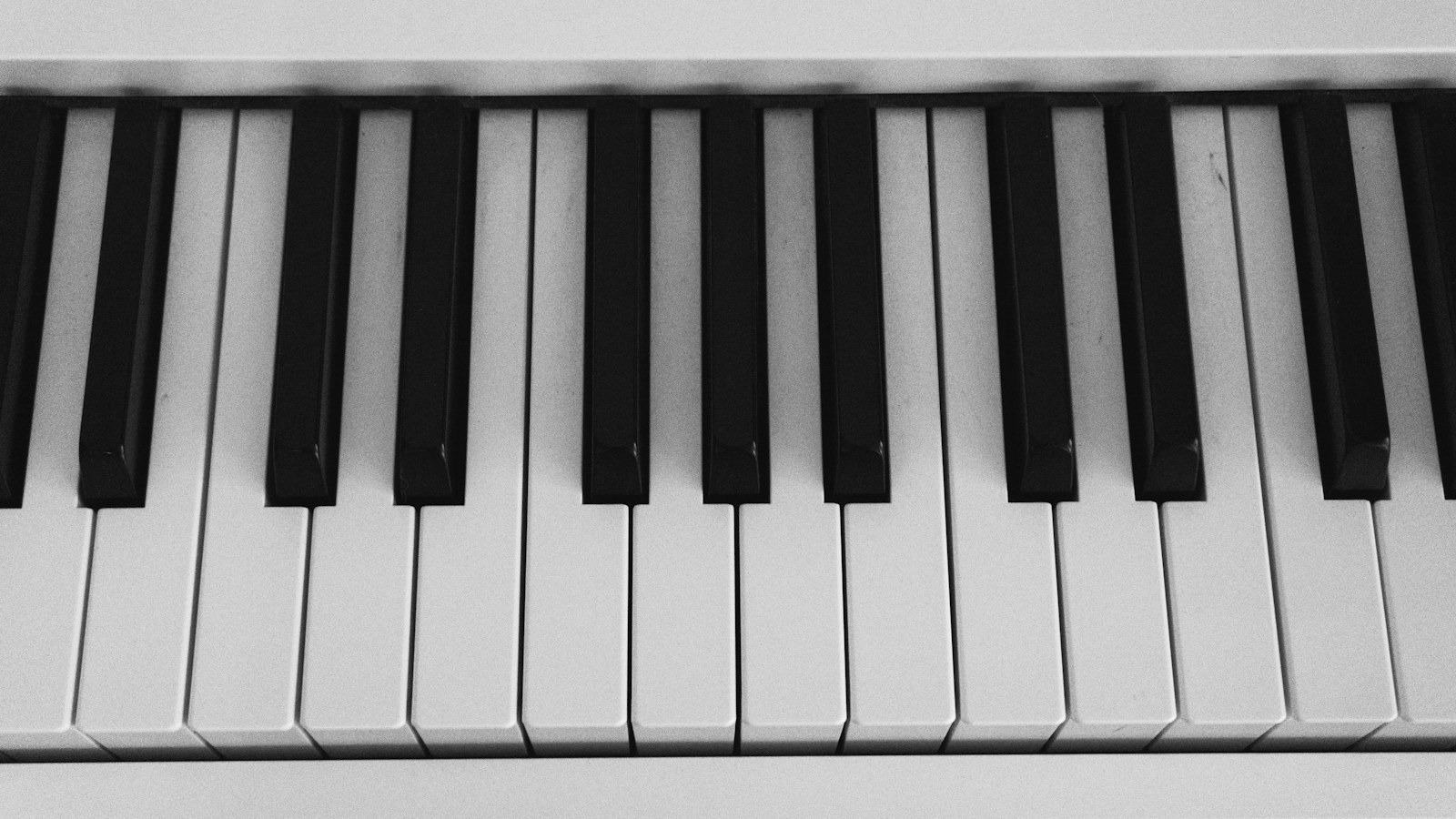 Black and white piano keys arranged in rows